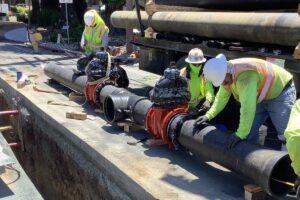 Cal Water employees repairing water main