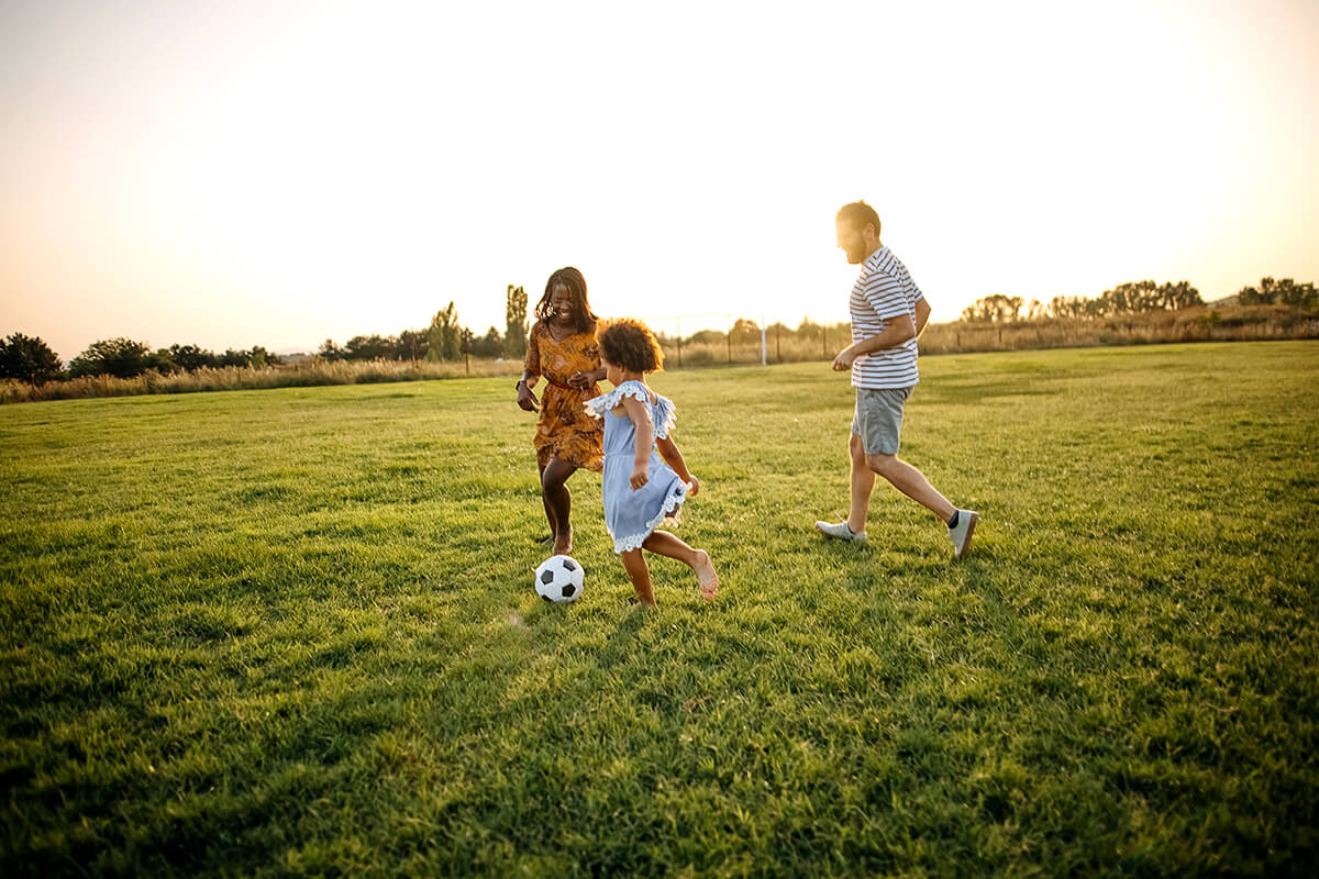 GettyImages-1332706272 Family playing soccer