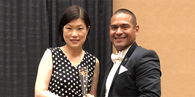 Elissa Ouyang and Jose Espinoza accept the American Water Works Association National Diversity Award on behalf of Cal Water
