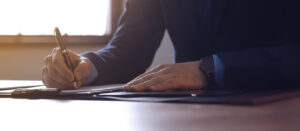 Person Writing on Paper