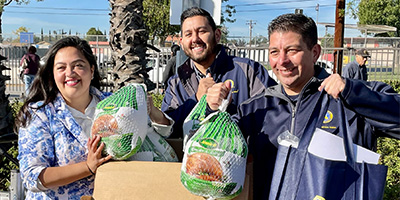 Employees with Operation Gobble turkeys