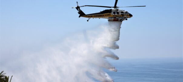 LA County Fire helicopter discharging water picked up from water supply station known as a Helopod