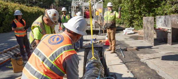 Workers installing water main