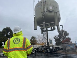 Crain lowering tank being installed in Visalia