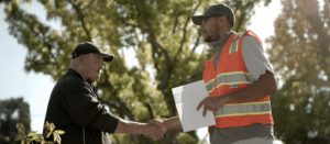 Customer and employee shaking hands